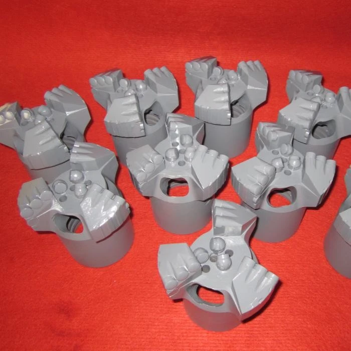 Construction drill bits
